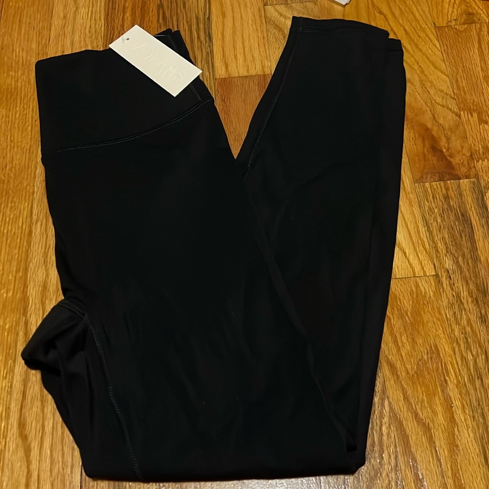 Volare active war black womens legging with flat front and curved back. Size M
